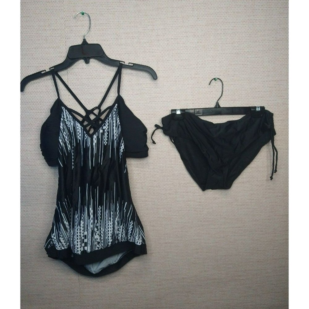 Black and white 2 PC bathing suit with Open sides and strappy back size Large